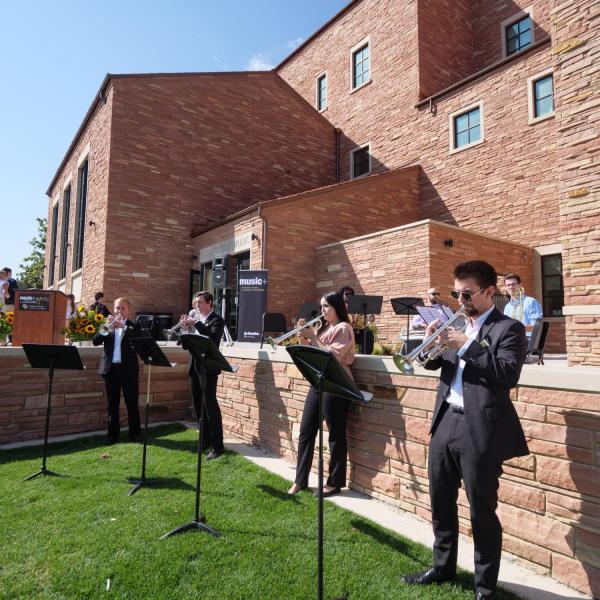 Musicians open up ceremonies as attendees gather for the official ribbon-cutting and opening of the Warner Imig Music building expansion on Sept. 17, 2021. (Photo by Glenn Asakawa/University of Colorado)