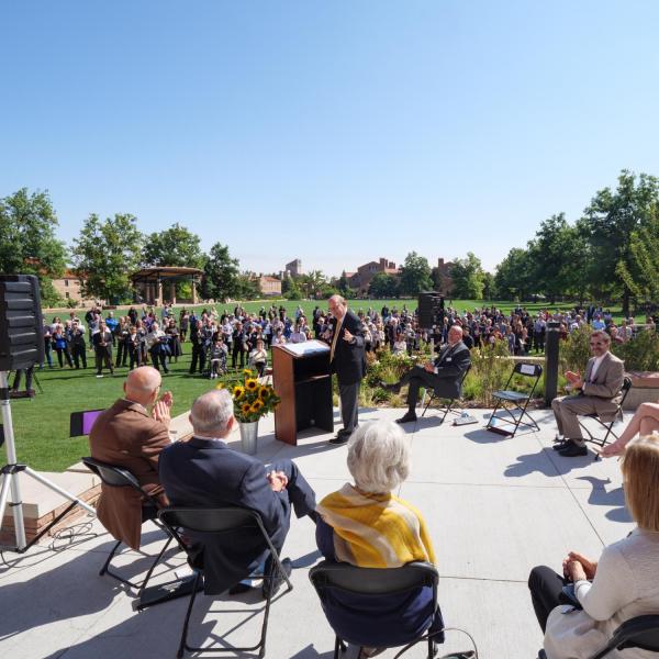 CU Boulder Chancellor Philip DiStefano, at podium, introduces the stage guests at the official ribbon-cutting and opening of the Warner Imig Music building expansion on Sept. 17, 2021. (Photo by Glenn Asakawa/University of Colorado)