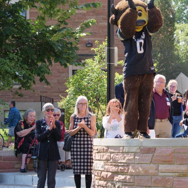 Chip and CU Regents Leslie Smith (standing far left) and Callie Rennison join attendees at the opening of the Warner Imig Music building expansion. (Photo by Glenn Asakawa/University of Colorado)