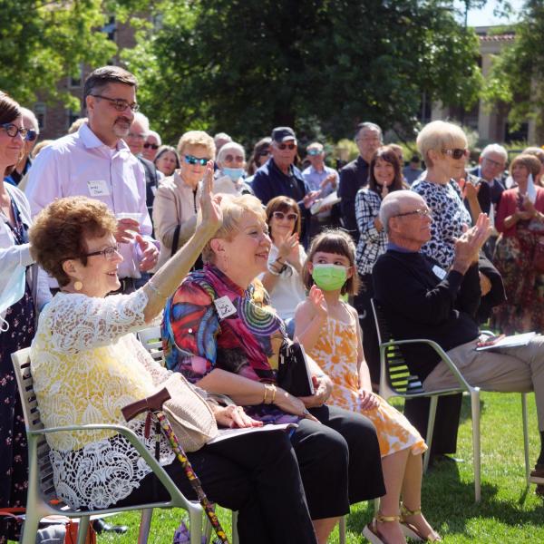 Warner Imig’s family members wave as they are acknowledged during the official ribbon-cutting and opening of the Warner Imig Music building expansion on Sept. 17, 2021. (Photo by Glenn Asakawa/University of Colorado)