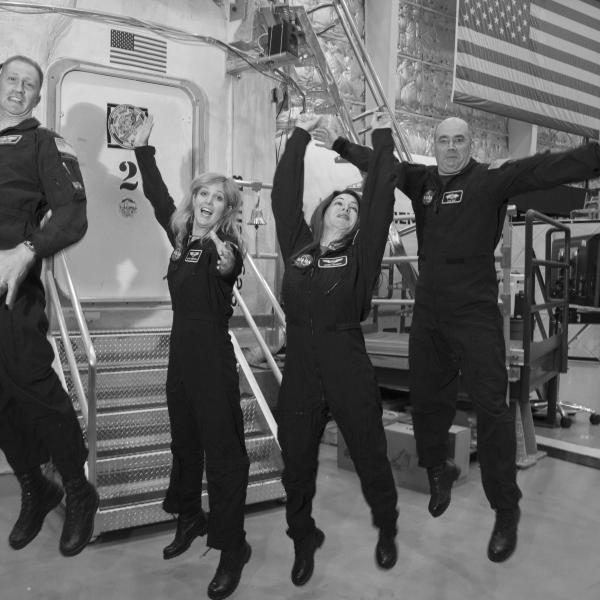 The four members of Mission XII celebrate after the mission is over