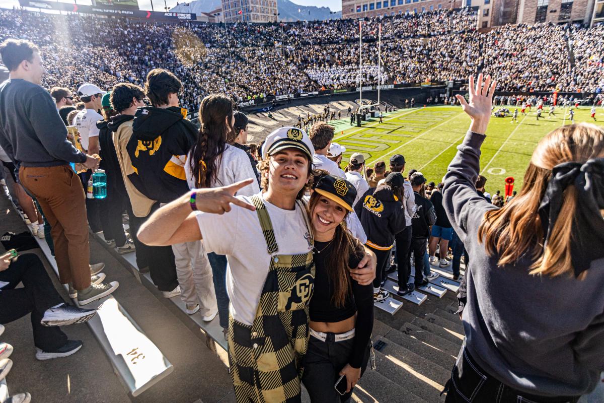 Buffs fans pose for a photo in the stands at Folsom Field