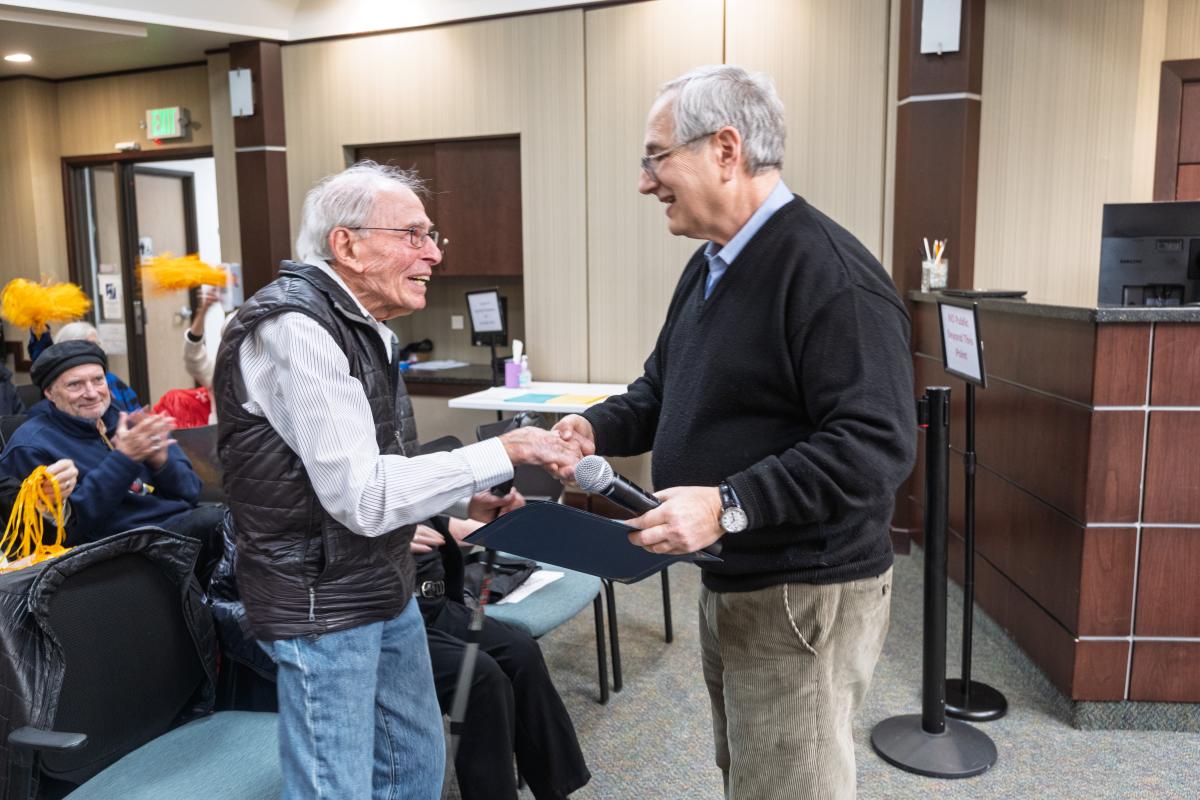 Richard Jessor shaking hands with Councilman Mark Wallach