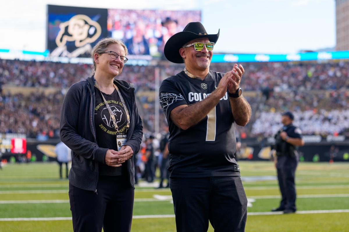 CU Chancellor Justin Schwartz congratulates Katherine Stange