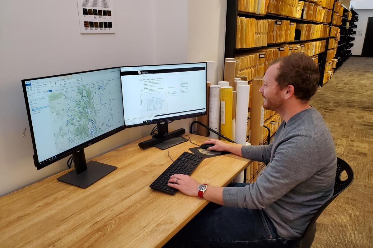 A person using Colorado GeoLibrary on a computer