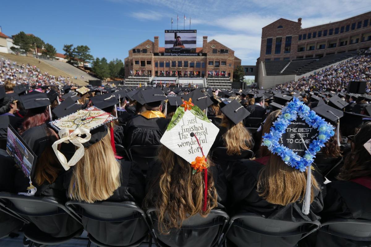 Decorated graduation caps during ceremony