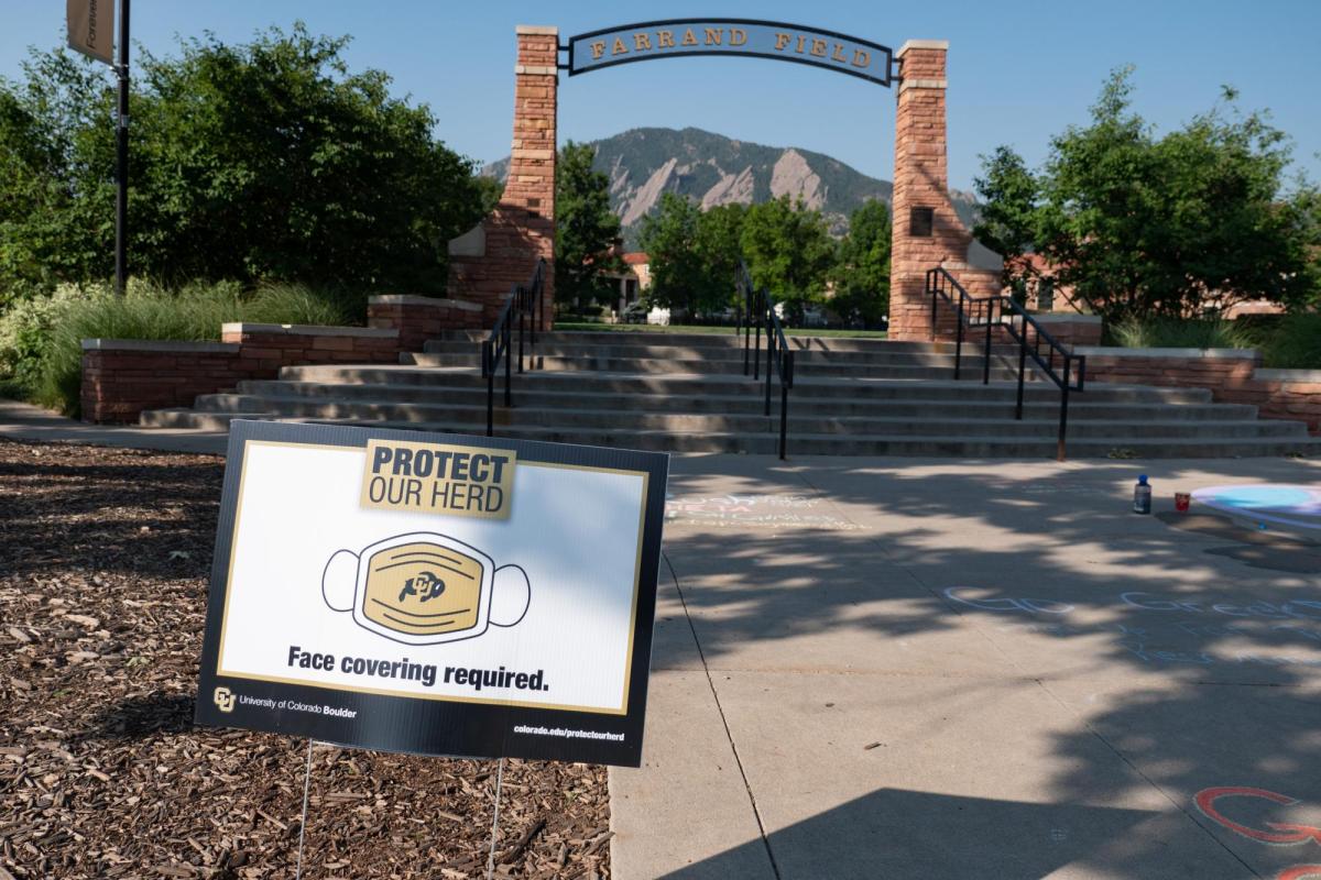 A Protect Our Herd&ndash;face covering required sign at the entrance of Farrand Field