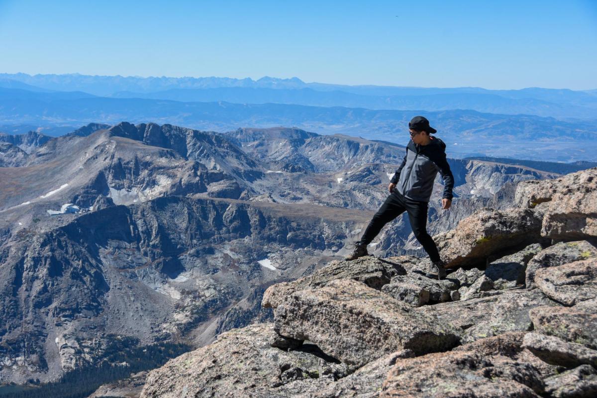 Person standing near edge of cliff - 'Be Boulder' 2018 photo contest winner by Ruiqi Li