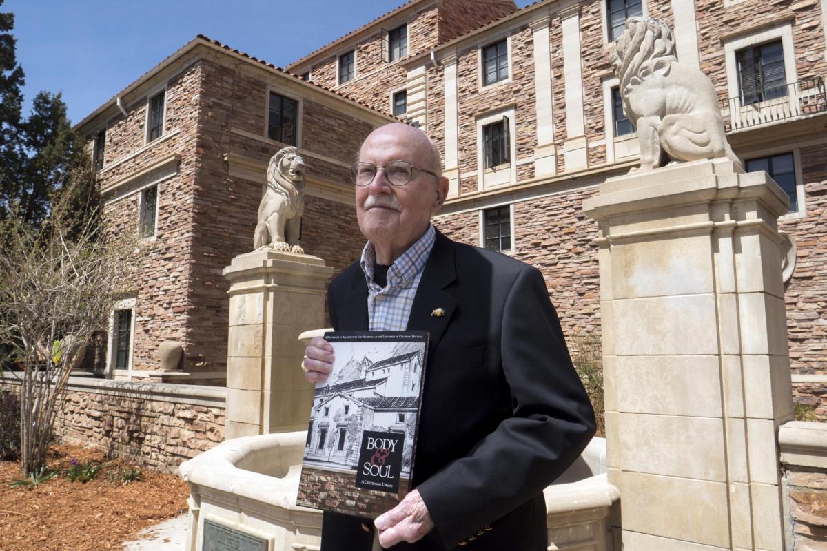 Campus Architect Emeritus Bill Deno poses for photo with new Body & Soul book