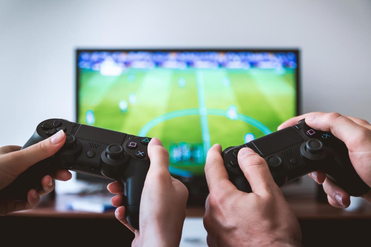 video game controllers in front of esports game