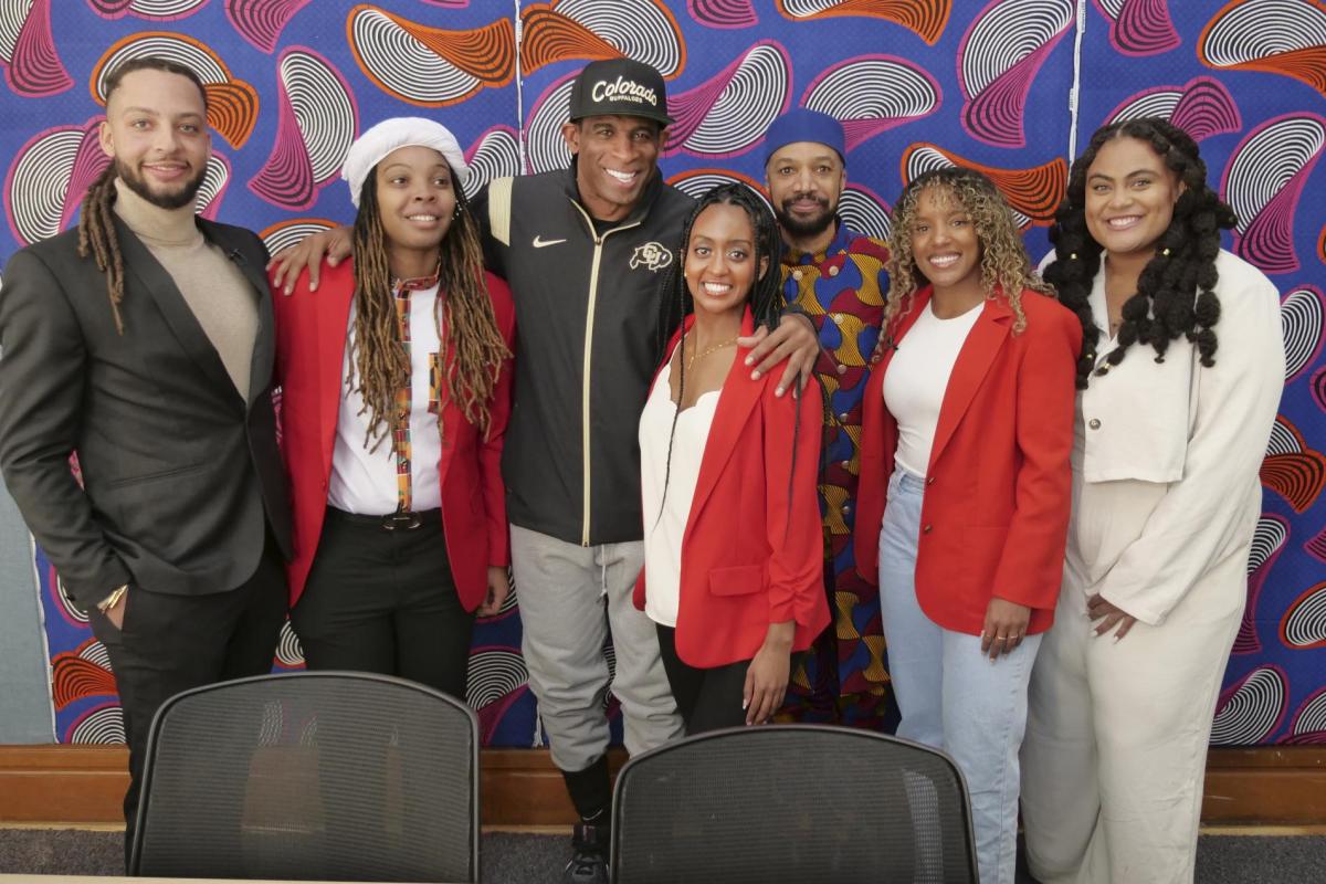 CAAAS staff pose with founder and director Reiland Rabaka and Deion 'Coach Prime' Sanders