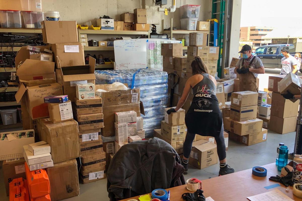 Volunteers from Team Rubicon load up CU Boulder PPE donations on Friday, April 13, 2020. (Sam Bogan/CU Boulder)