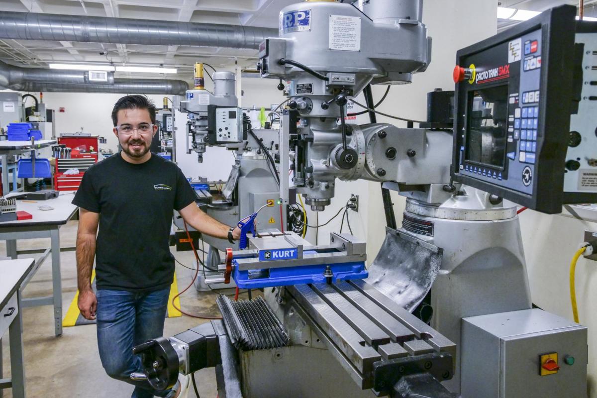 Behruzkhon Rashidov, President and founder of the CU Boulder Racing Team, works in the Idea Forge Machine shop.