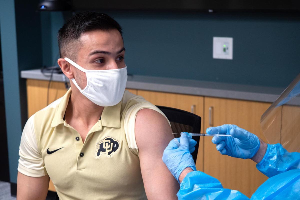 A student getting a vaccine