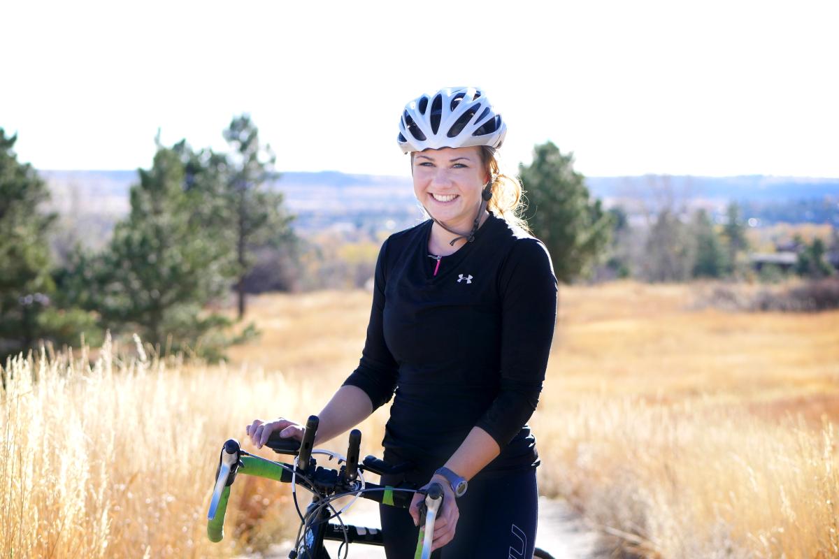 Laura Knoblach poses with her bicycle