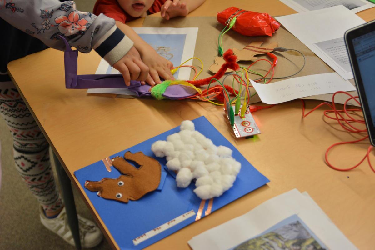 kids create book in the Literacy and Media Lab