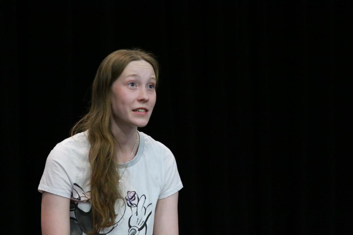 Student performing 'Edges' on stage