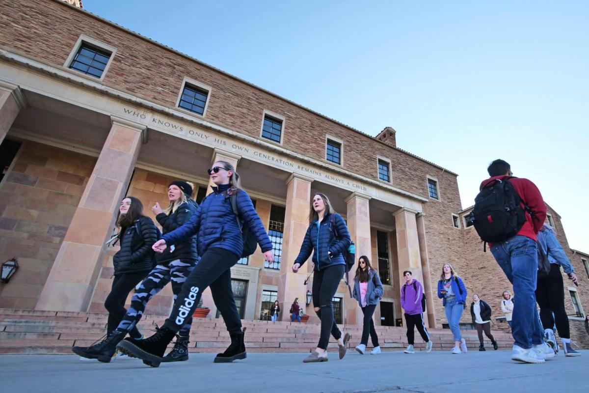 Students make their way past Norlin Library on the first day of classes for spring 2020 at CU Boulder. (Photo by Casey A. Cass/University of Colorado)