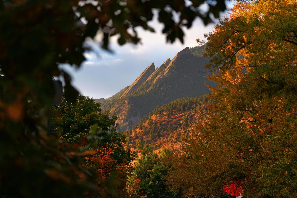 The majestic Flatirons above Boulder framed in fall colors.