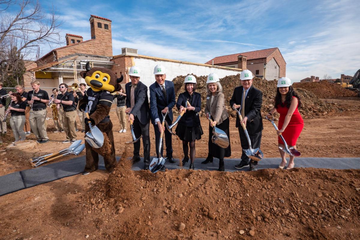 CU mascot Chip, left joins dignitaries for a photo during the CU College of Music groundbreaking ceremony for the expansion of their building. Photo by Glenn Asakawa.