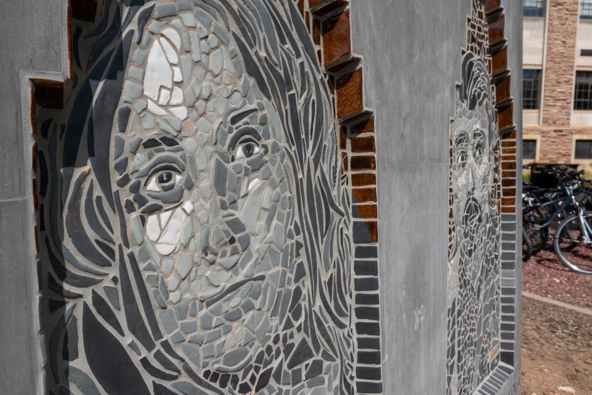 A sculpture, created by former CU Boulder master of fine arts student Jasmine Baetz, memorializes six students who advocated for the rights of Chicanos/Mexican Americans in higher education and appears as a low rectangular block in mosaic, brick and cement materials depicting busts of the victims. (Photo by Glenn Asaka