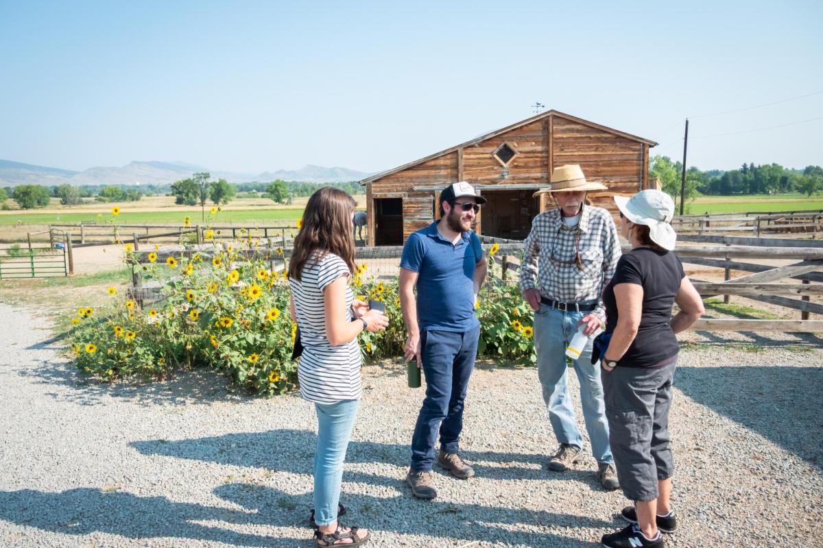 Aaron Treher and Molly McDermott speak with the Cargills at their farm.