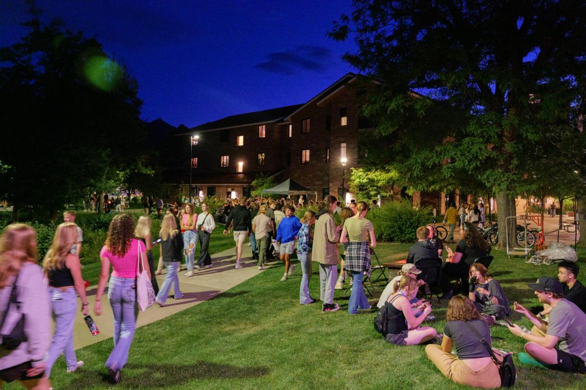 students on campus at night