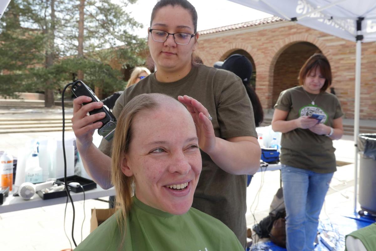 First-year ENVD student Nicole Elder donates her hair. Photo by Casey A. Cass.