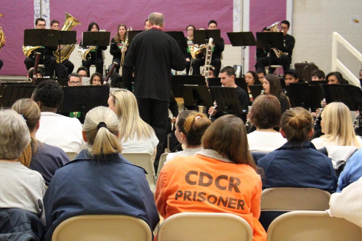 Larry Stoffel conducting a concert in front of those incarcerated in a state prison