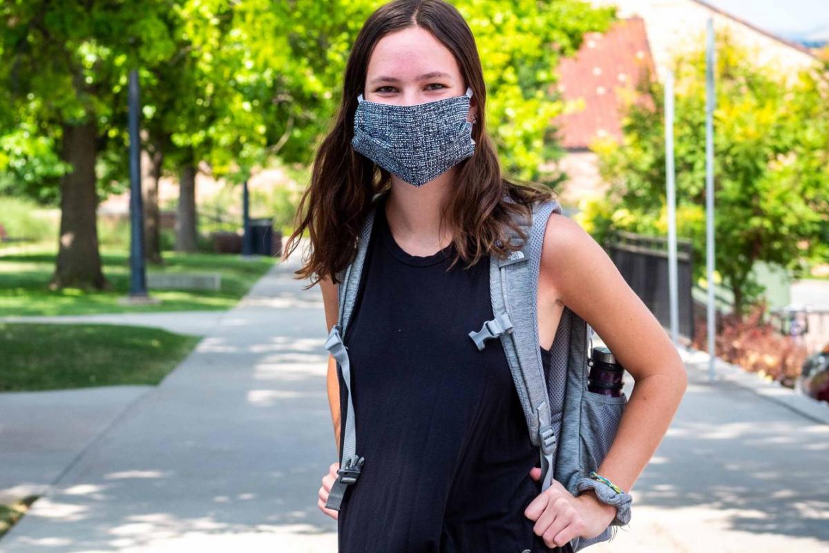 Student wearing a mask on campus