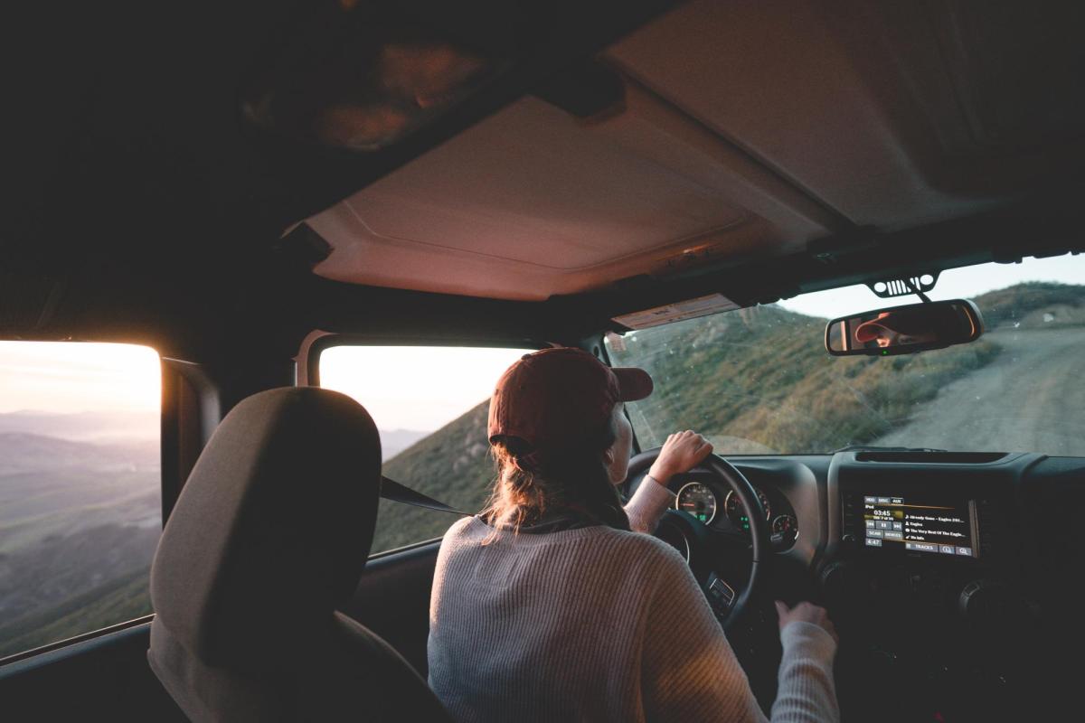person driving in the mountains
