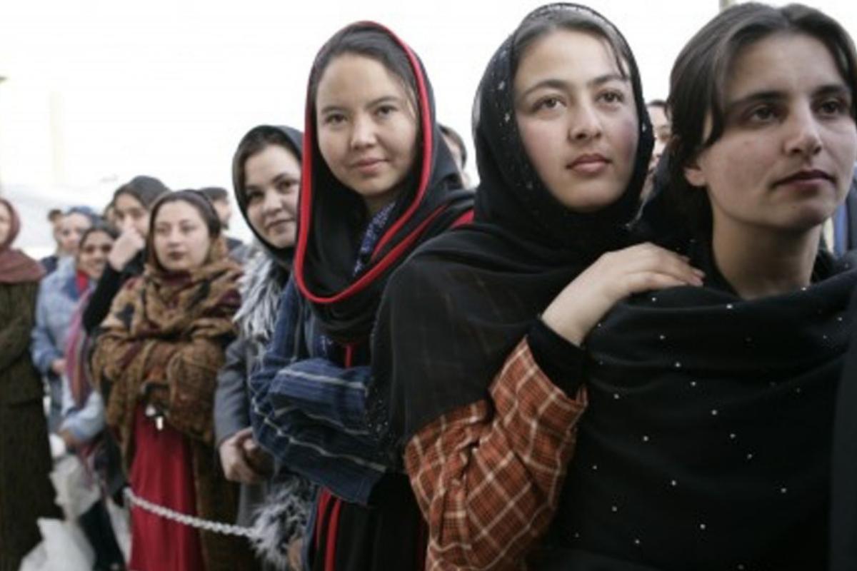 Women of Afghanistan stand outside the U.S. Embassy in Kabul, Wednesday, March 1, 2006. President George W. Bush and Laura Bush made a surprise visit to the city and presided over a ceremonial ribbon-cutting at the embassy. (Staff Sgt. Russell Lee Klika, US Army National Guard; Source: Wikimedia Commons)