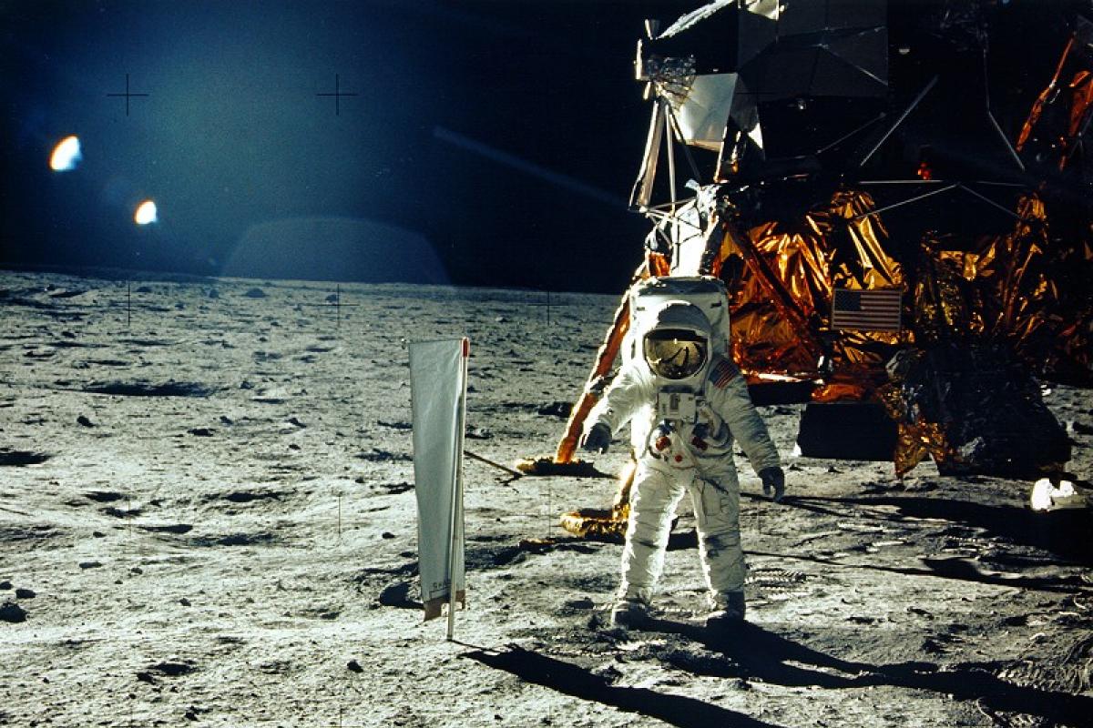 Astronaut Buzz Aldrin standing next to lunar lander