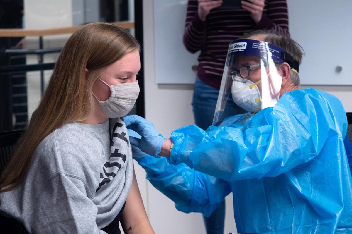 CU Boulder student Olivia Parsons getting a COVID-19 shot