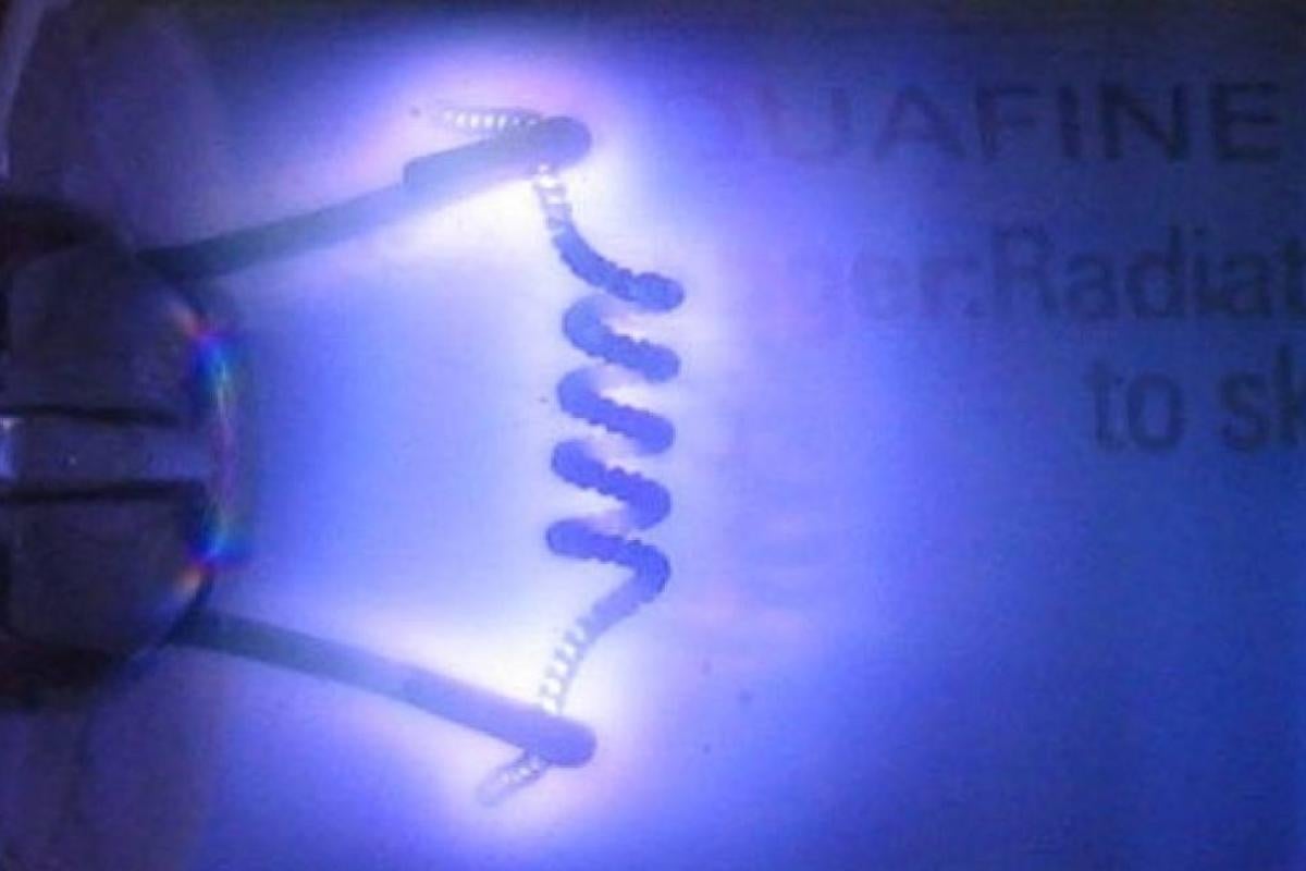 A germicidal ultraviolet lamp glows purple