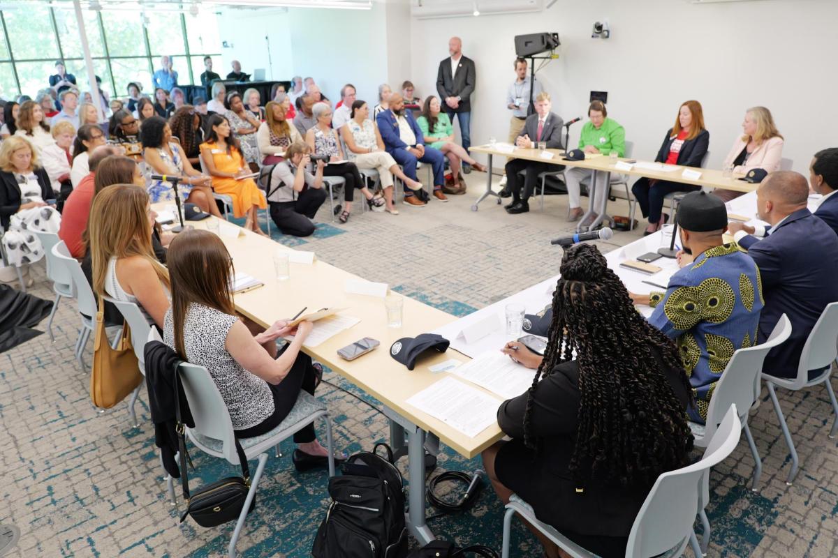Panelists and attendees discuss gun violence prevention.