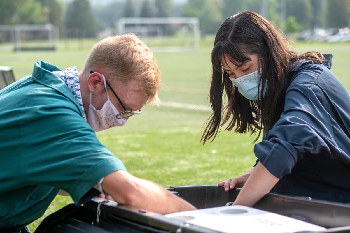 Researchers check on a sampling station