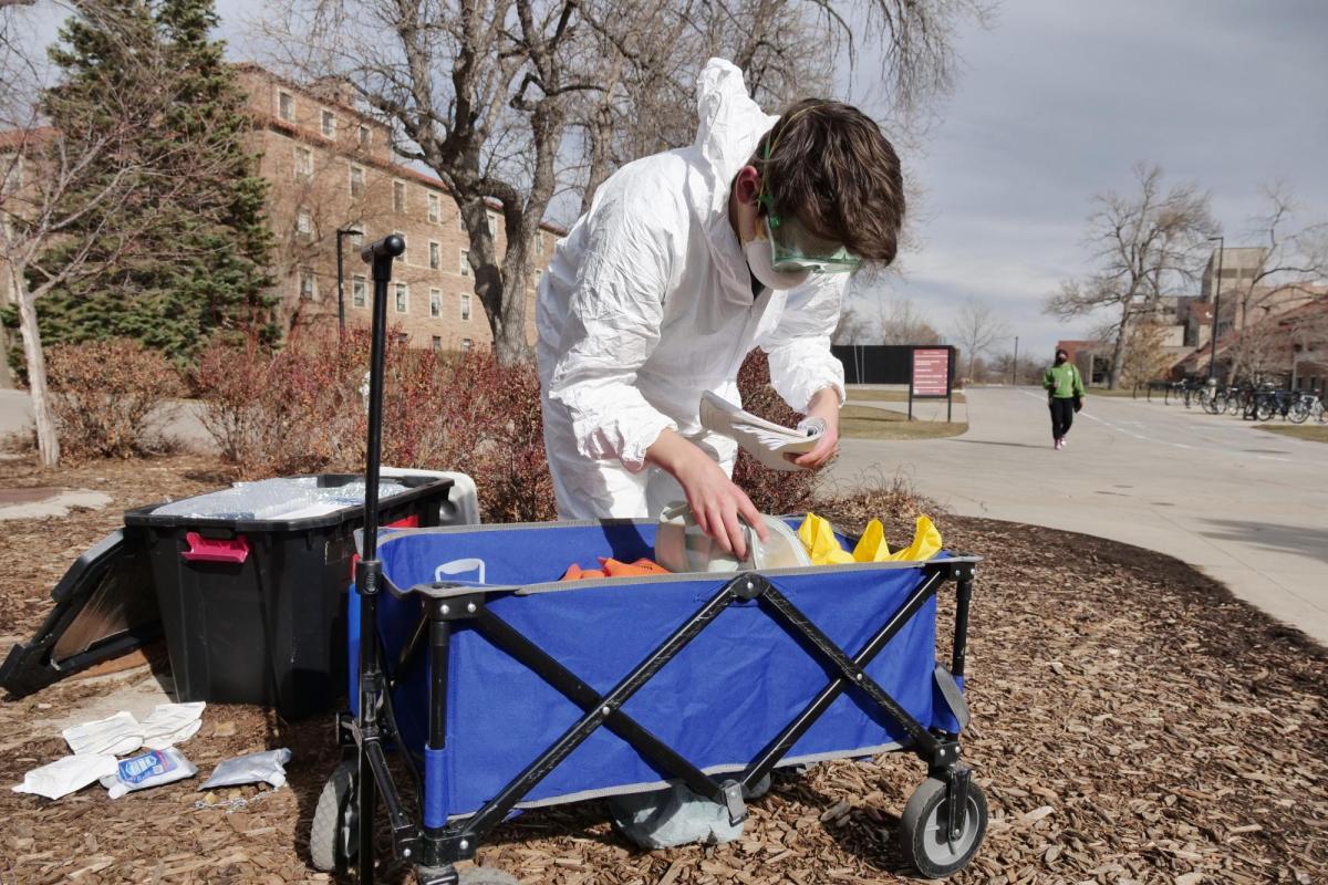 Researcher collecting waste water sample