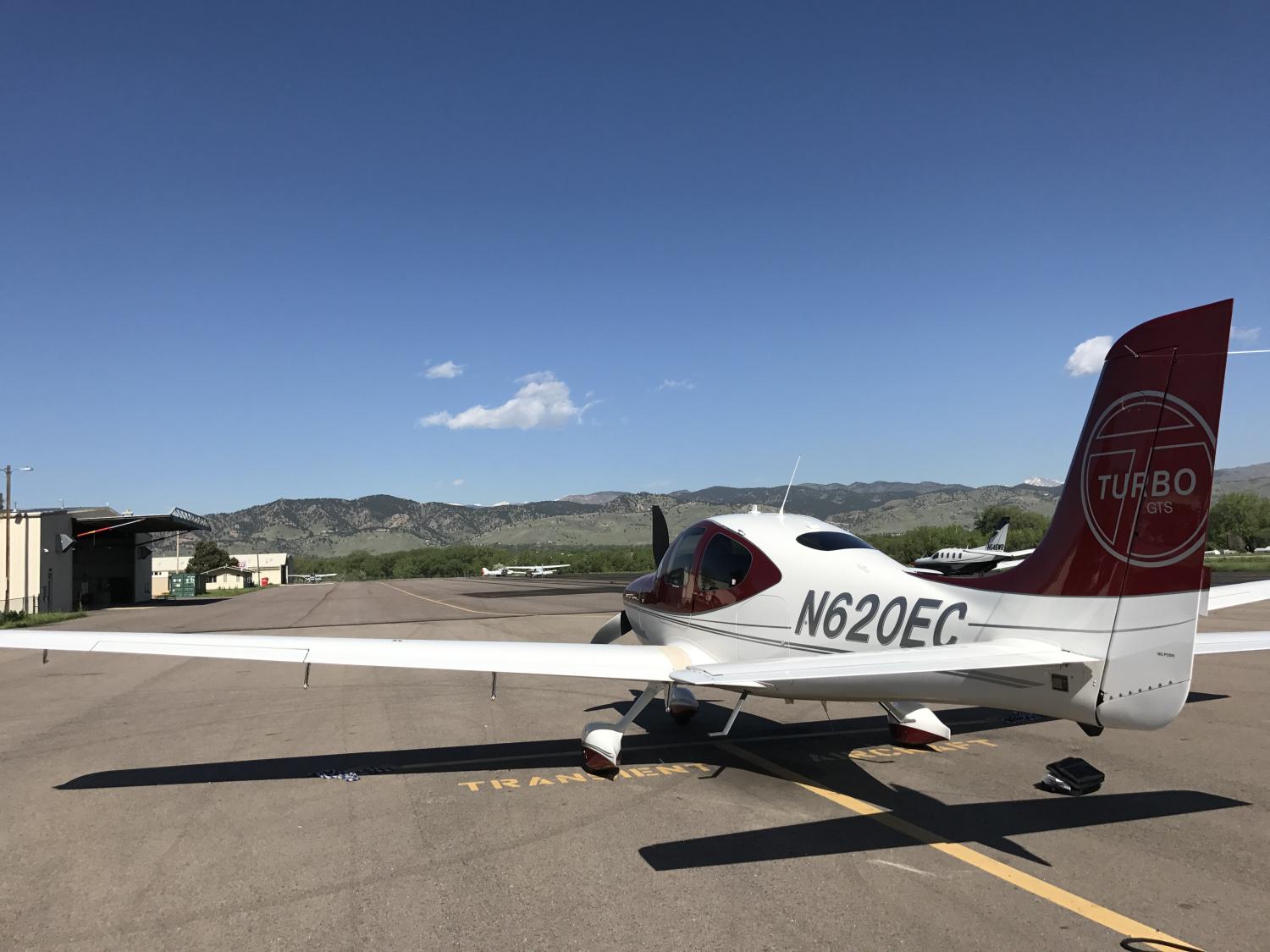 an airplane on the runway at boulder municipal airport