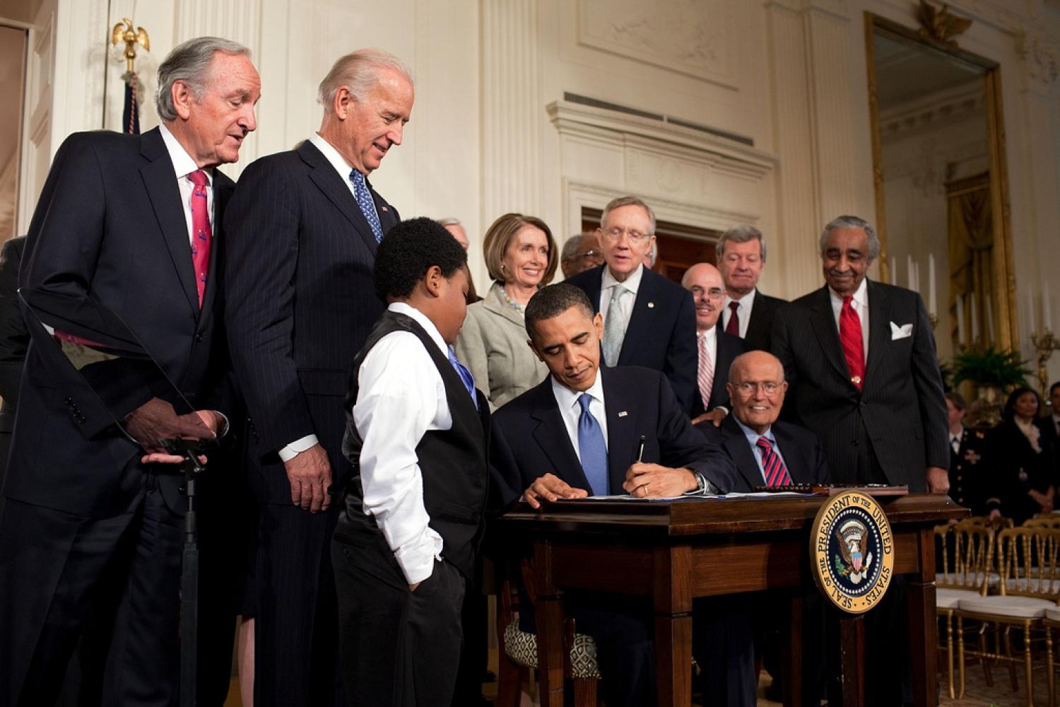 Obama signing the Affordable Care Act