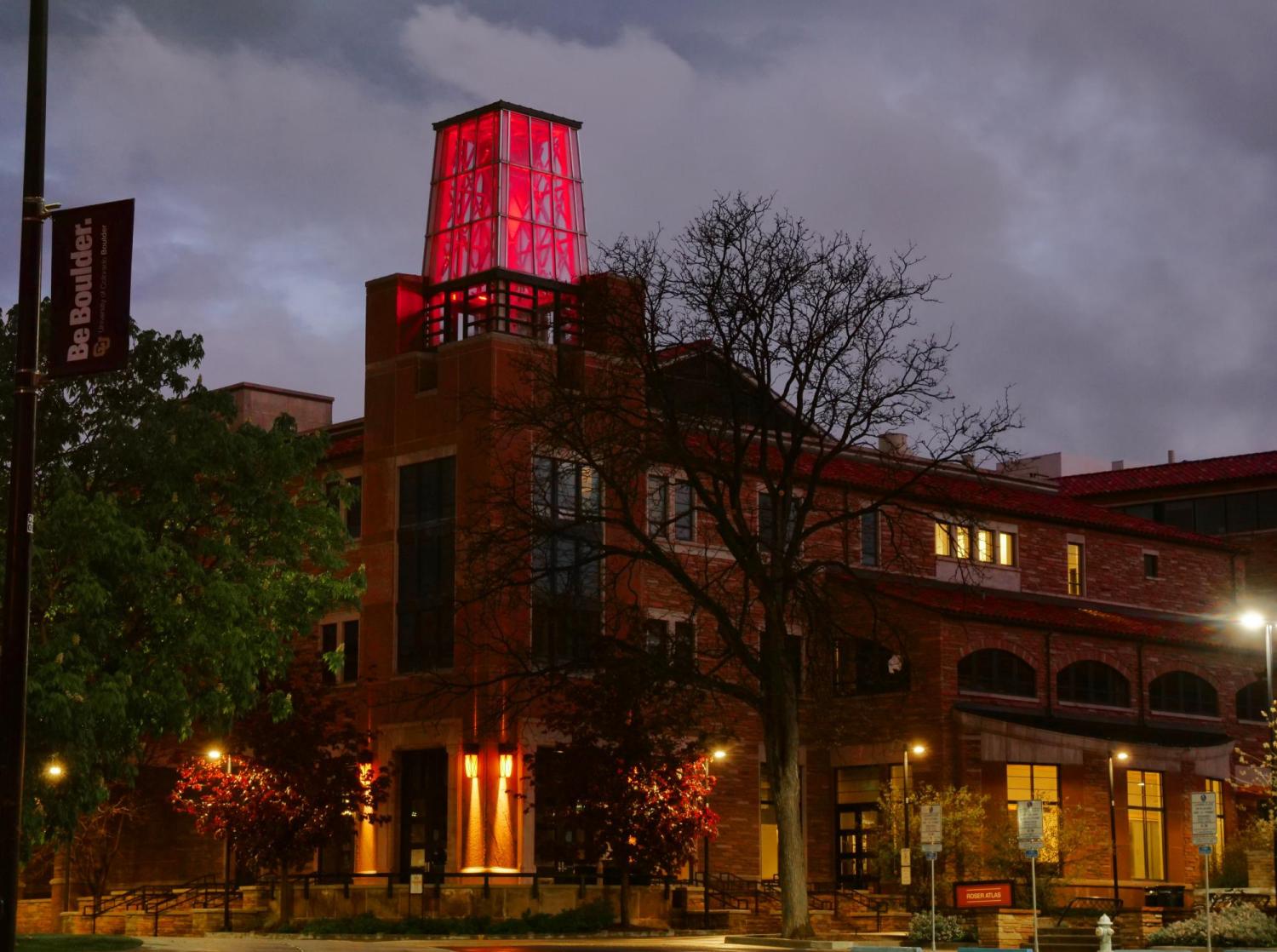 The ATLAS Building towers shines red to honor Coloradans lost to COVID-19 on Friday, May 15, 2020. (Photo by Casey A. Cass/University of Colorado)