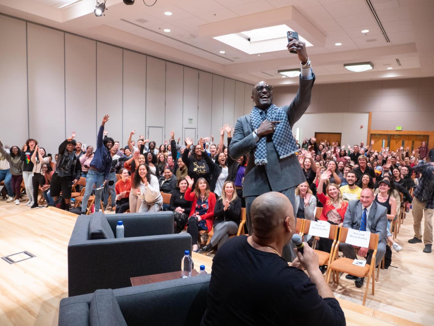 Yusef Salaam captures a selfie as he and Raymond Santana, two of the five "Exonerated Five" who were wrongly convicted of a brutal attack on a Central Park jogger answered questions during an informal Cultural Events Board talk at the University Memorial Center on March 10, 2020. 