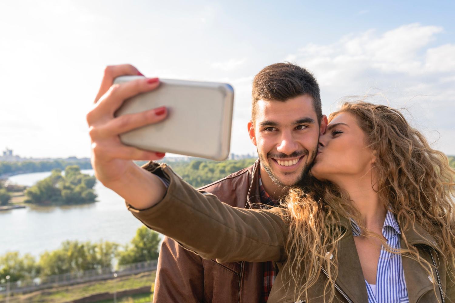 Couple taking a selfie with a smartphone