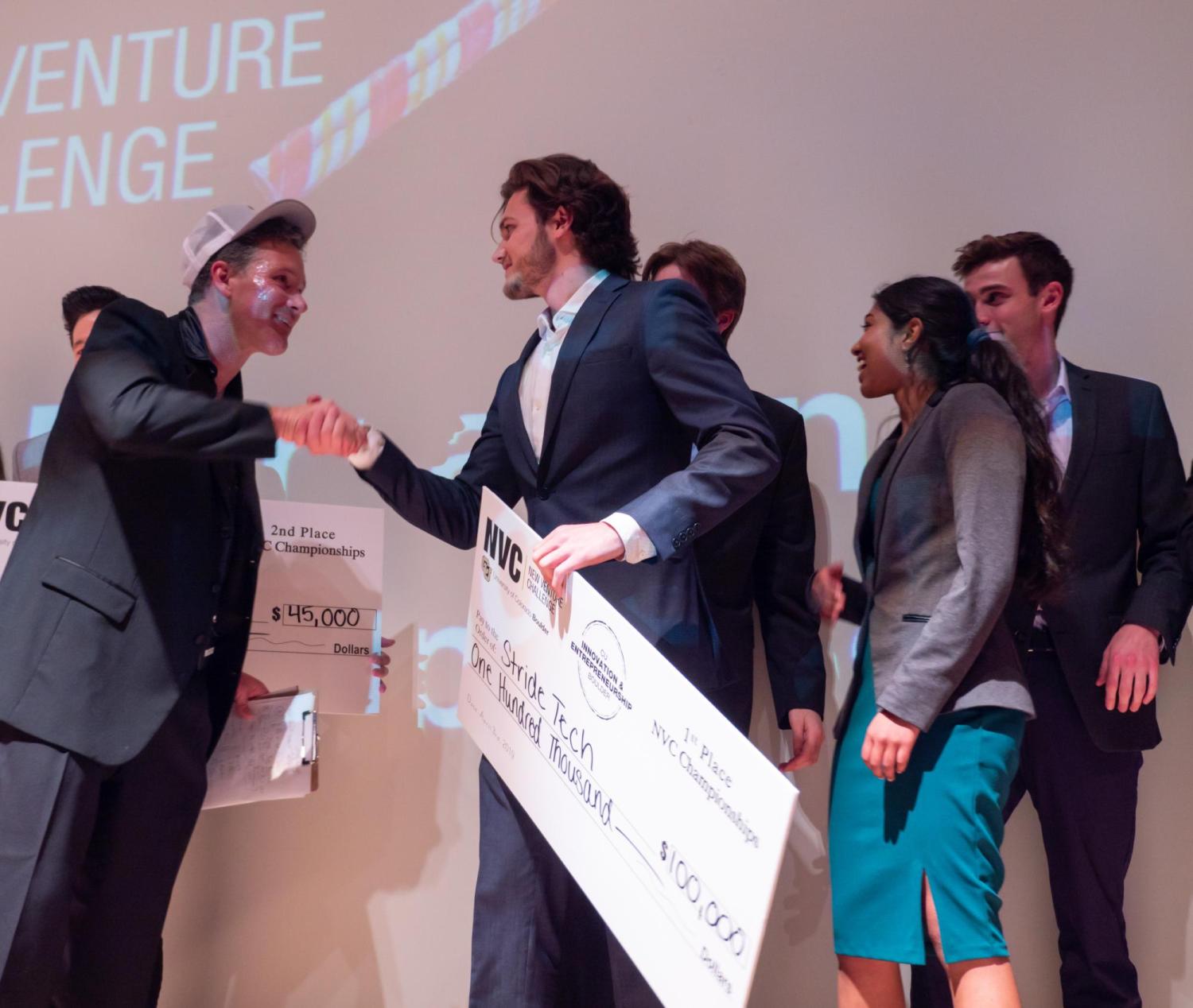 New Venture Challenge winners receive a giant check