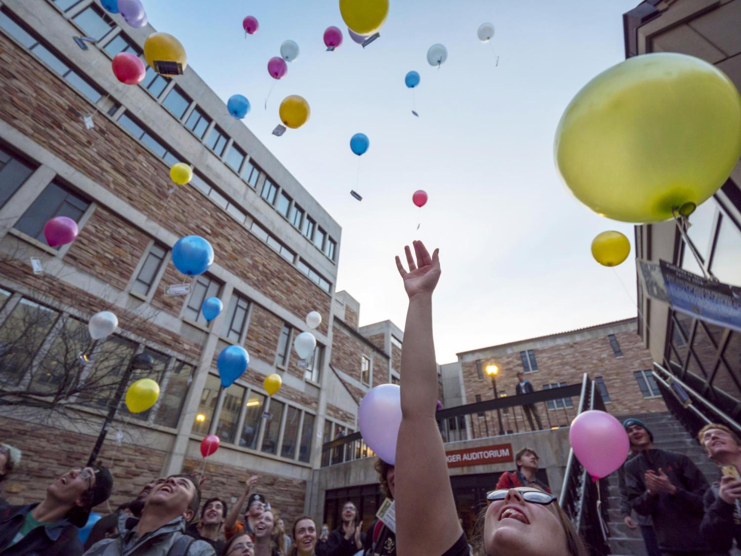 Students release biodegradable balloons as part of class project