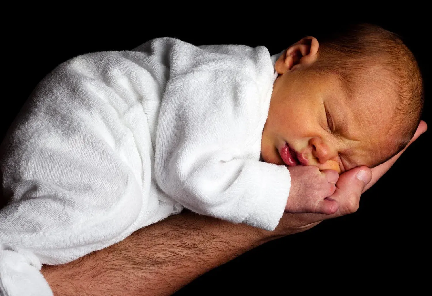 Baby sleeping on an arm