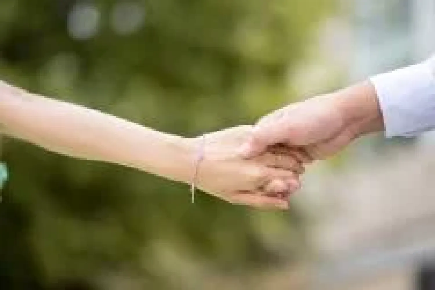 stock image of people holding hands