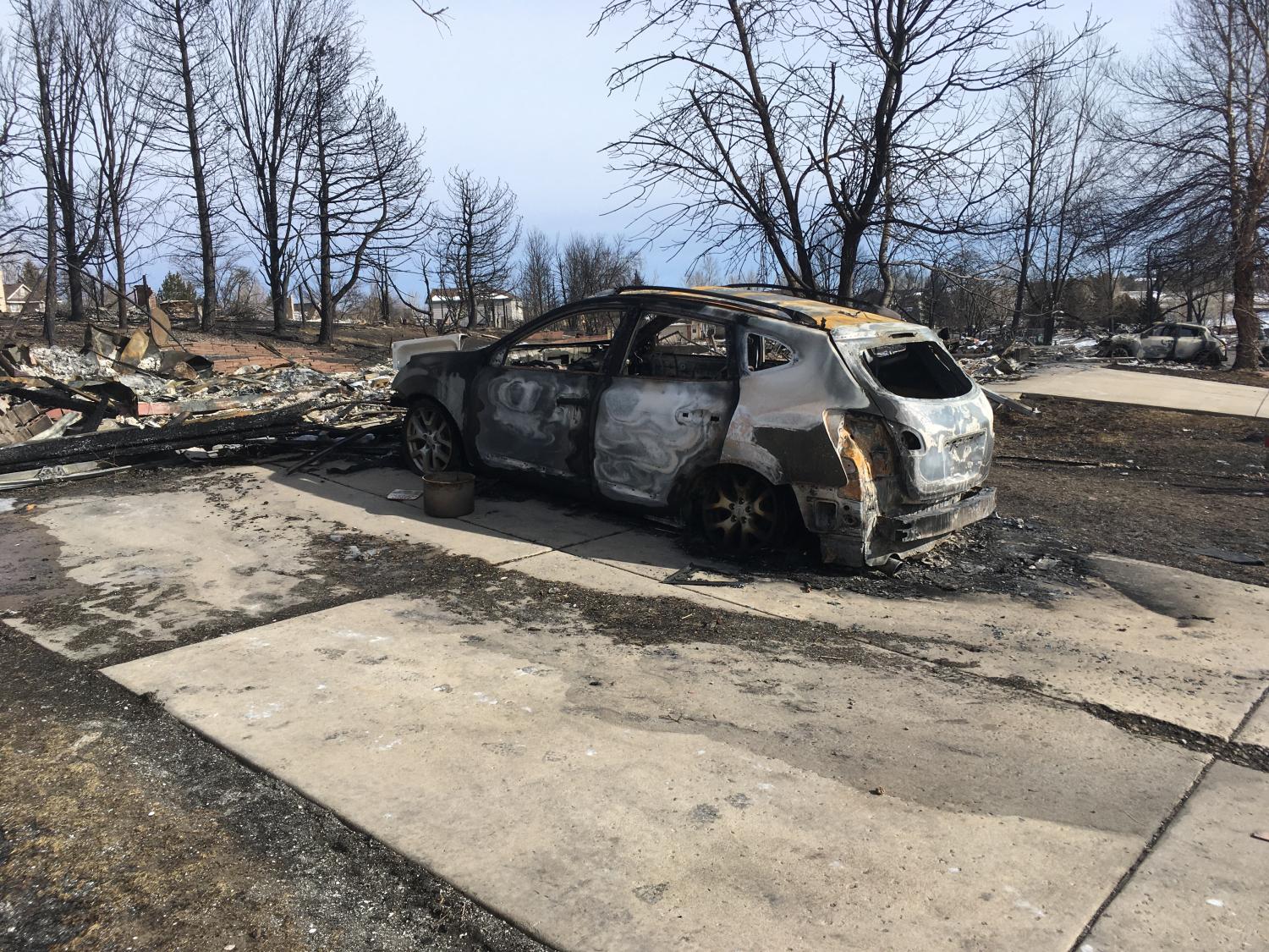 A burned car after the Marshall Fire