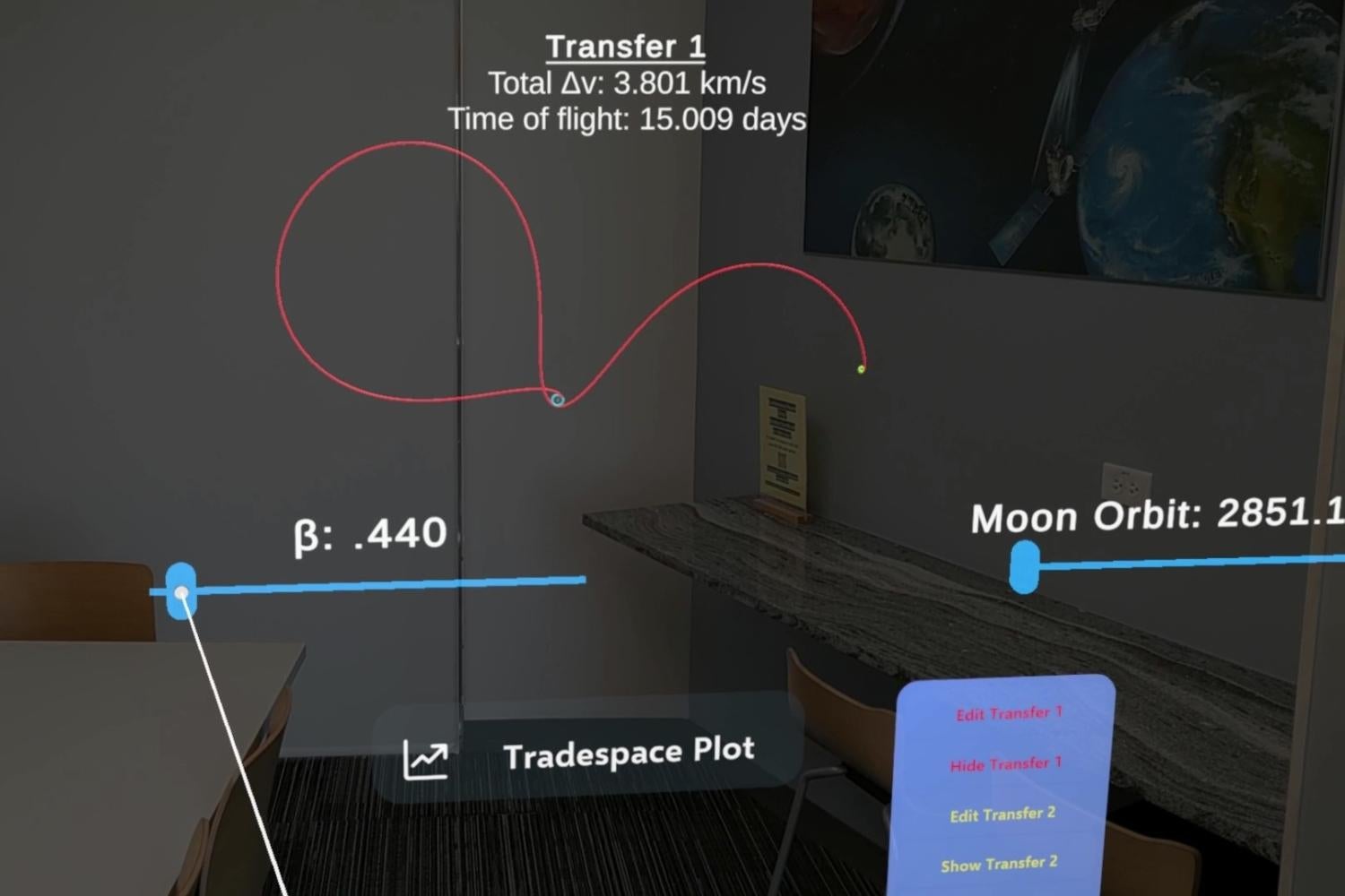 Screen capture from an aurgmented reality display revealing a looping red line representing a path from Earth to the moon.