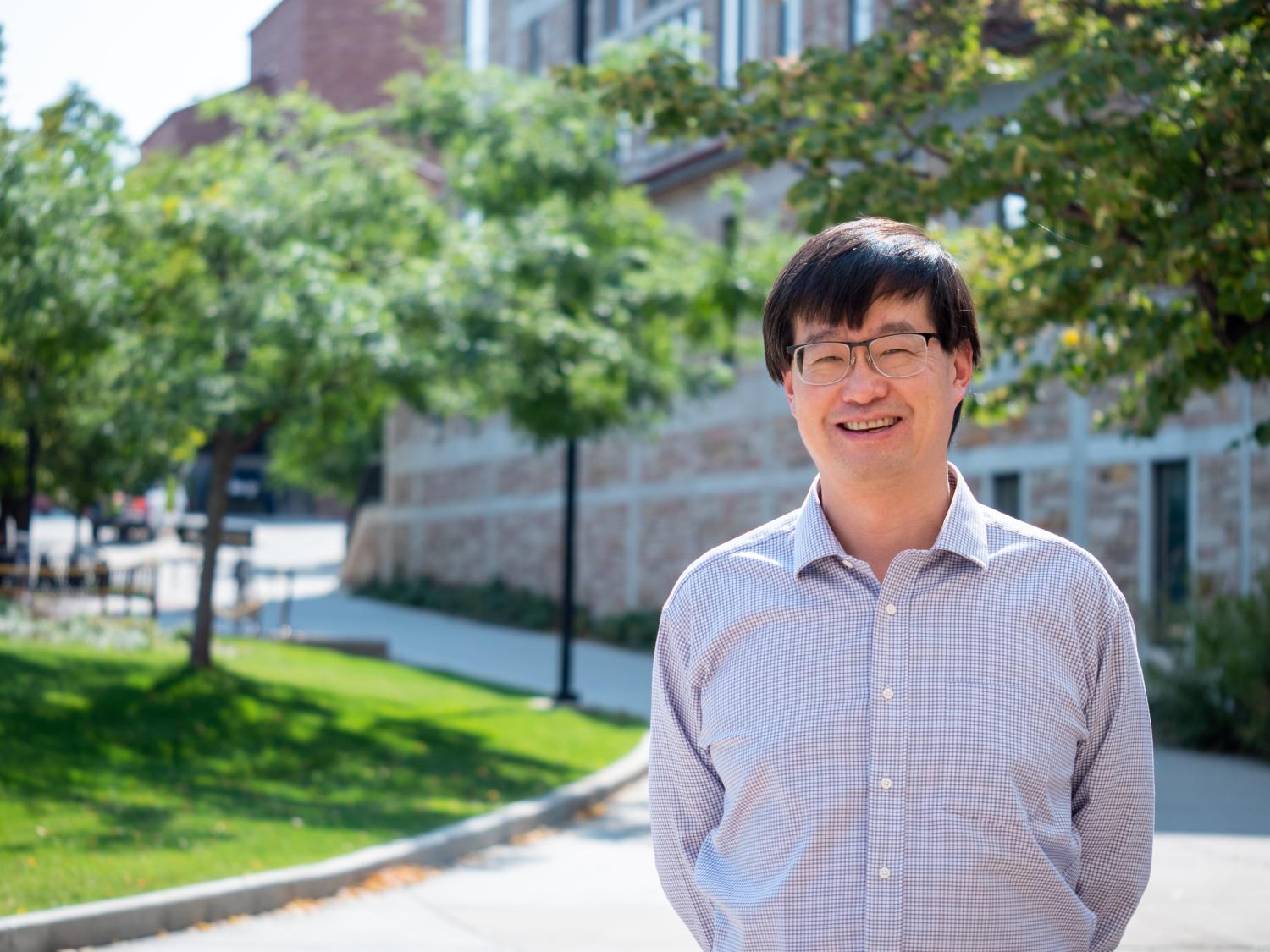 Jun Ye standing outdoors